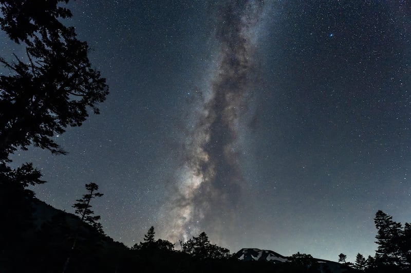 Starry night sky over a city